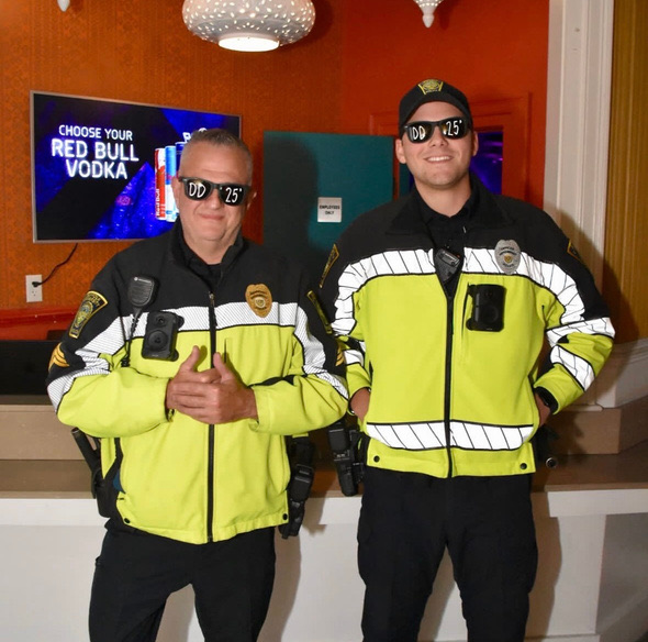 Two attendees in high-visibility costumes at the event